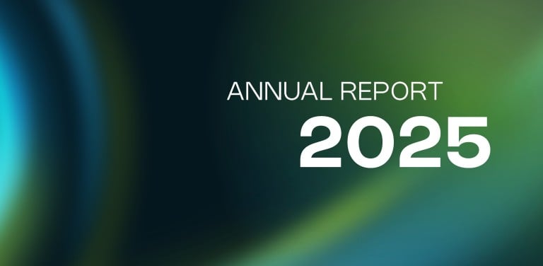 Cover page of the Annual Report 2025 with an blue-green gradient background and the text “Annual Report 2025”.